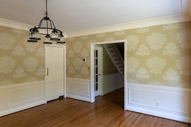 unfurnished dining area with crown molding and dark wood-type flooring