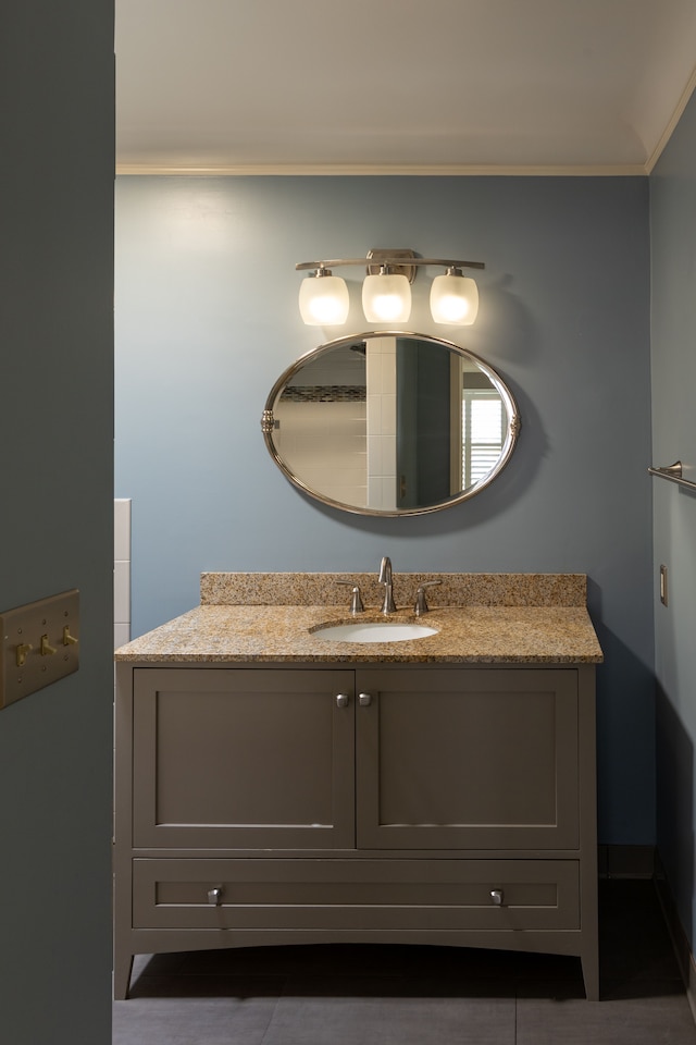 bathroom featuring vanity and ornamental molding