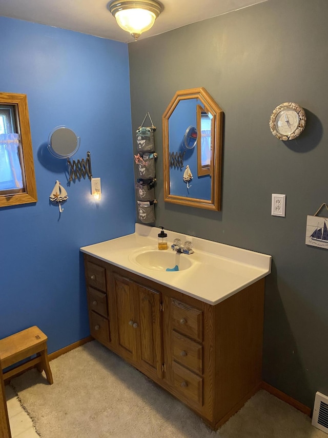 96 Harold St, Grant, MI 49327 - bathroom featuring vanity and baseboards