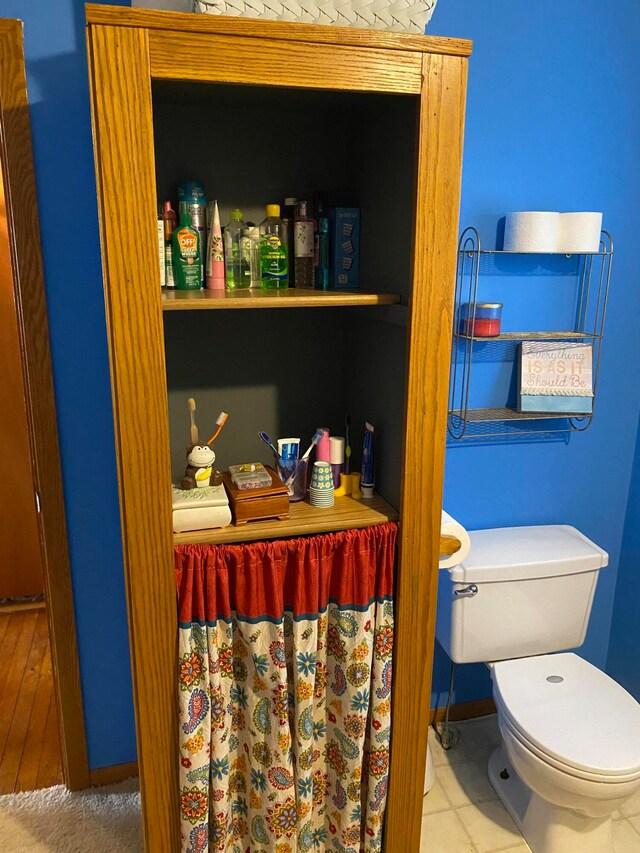 bathroom featuring tile patterned flooring and toilet