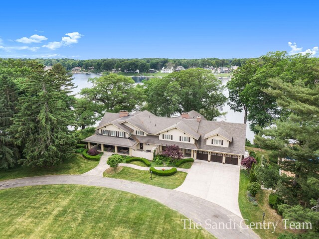 18635 N Fruitport Rd, Spring Lake, MI 49456 - view of subject property with a nearby body of water and a tree filled landscape