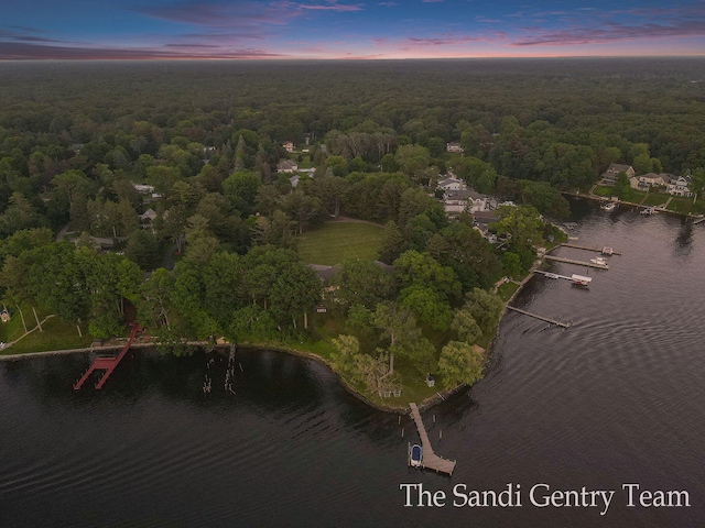 aerial view at dusk with a water view