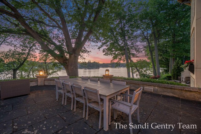 18635 N Fruitport Rd, Spring Lake, MI 49456 - view of patio featuring outdoor dining area and a water view