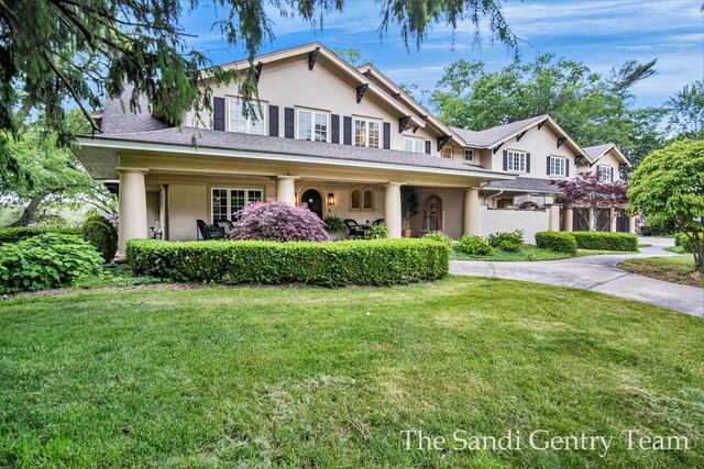 18635 N Fruitport Rd, Spring Lake, MI 49456 - view of front of house featuring stucco siding and a front yard