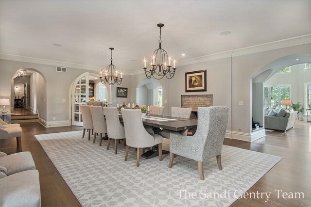 18635 N Fruitport Rd, Spring Lake, MI 49456 - dining space with arched walkways, plenty of natural light, baseboards, crown molding, and recessed lighting
