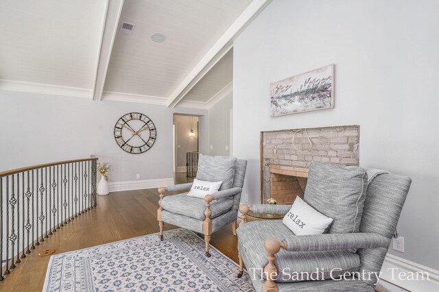 18635 N Fruitport Rd, Spring Lake, MI 49456 - living area featuring beamed ceiling, wood finished floors, and baseboards