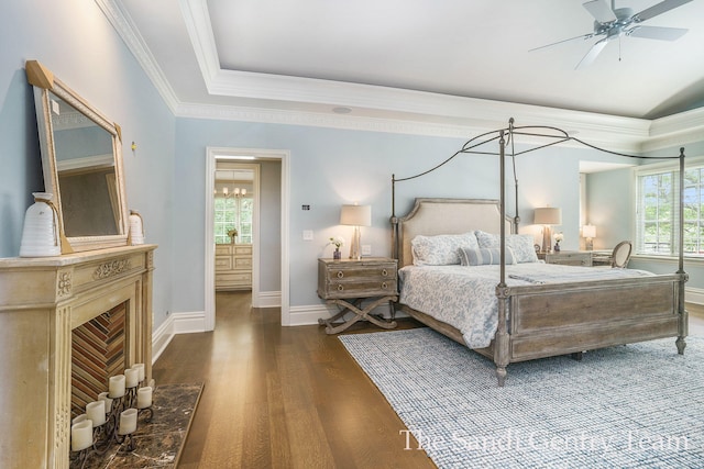 bedroom featuring dark hardwood / wood-style flooring, ceiling fan, and ornamental molding