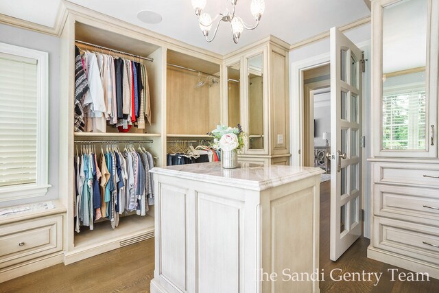 18635 N Fruitport Rd, Spring Lake, MI 49456 - spacious closet featuring a chandelier and dark wood-type flooring