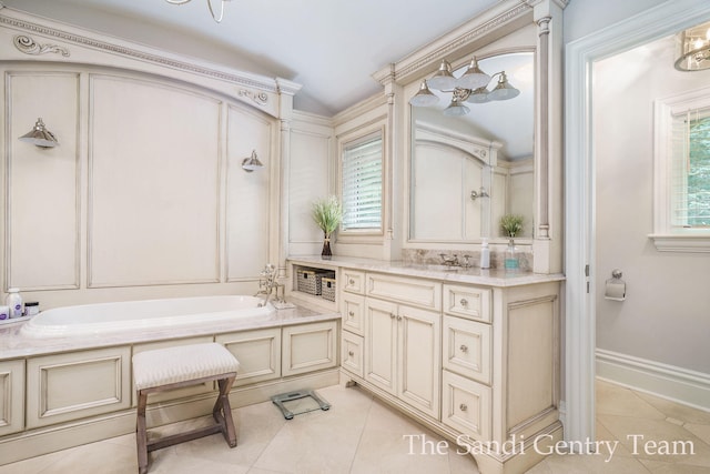 bathroom featuring tile patterned floors, a tub to relax in, and vanity