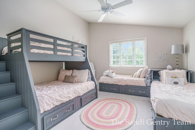 bedroom with carpet, ceiling fan, and lofted ceiling