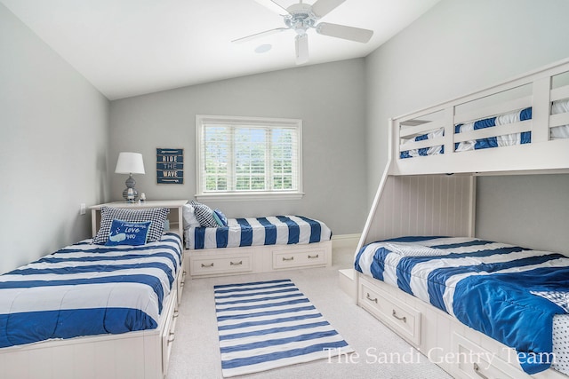 bedroom with carpet floors, vaulted ceiling, and ceiling fan