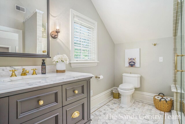 18635 N Fruitport Rd, Spring Lake, MI 49456 - bathroom with lofted ceiling, vanity, toilet, baseboards, and a shower