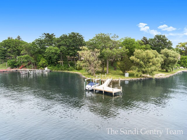 18635 N Fruitport Rd, Spring Lake, MI 49456 - dock featuring a water view and view of scattered trees