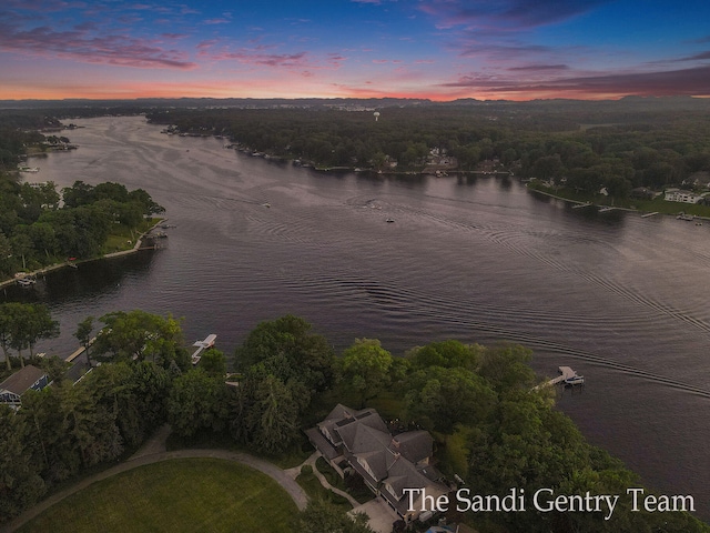 aerial view at dusk with a water view