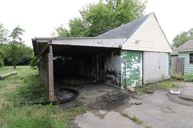 garage featuring a carport