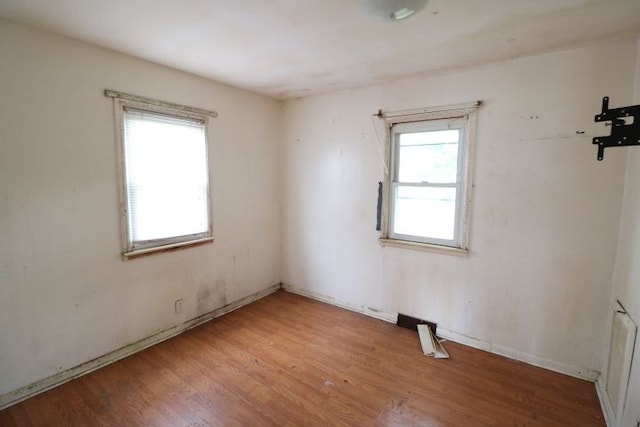 spare room featuring light wood-type flooring