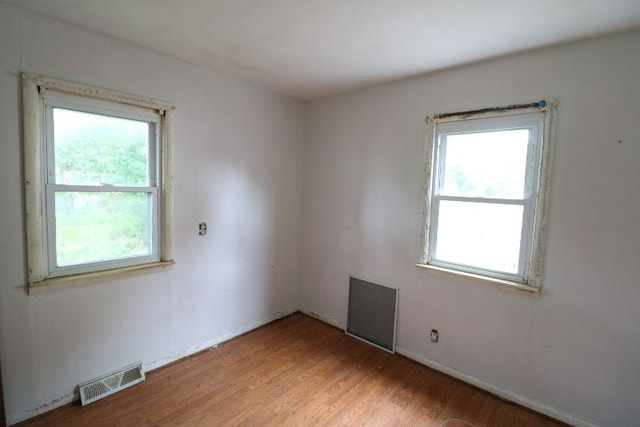 spare room with light hardwood / wood-style floors