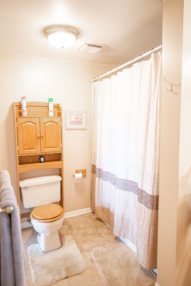 bathroom featuring toilet