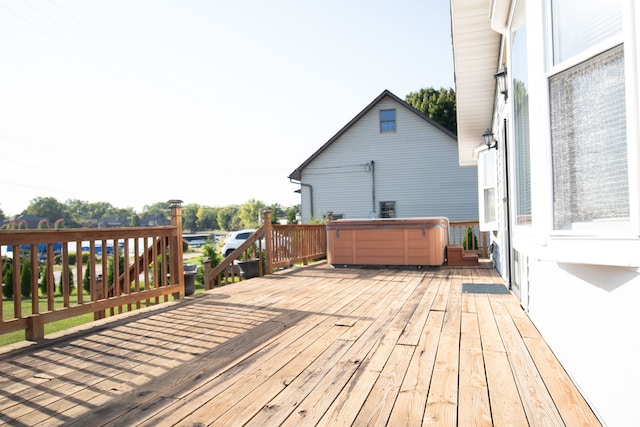 deck featuring a hot tub