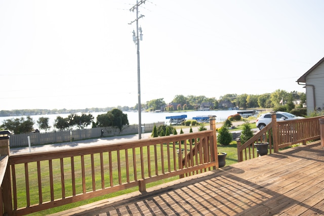 deck featuring a yard and a water view