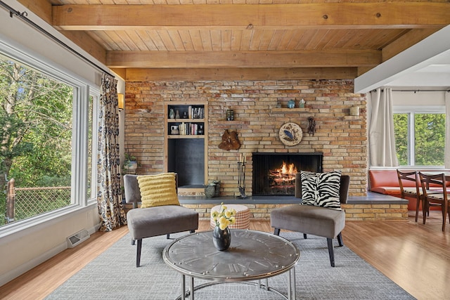 interior space with beam ceiling, hardwood / wood-style flooring, and wood ceiling