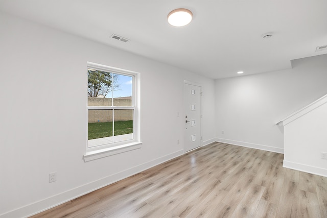 foyer entrance with light hardwood / wood-style flooring