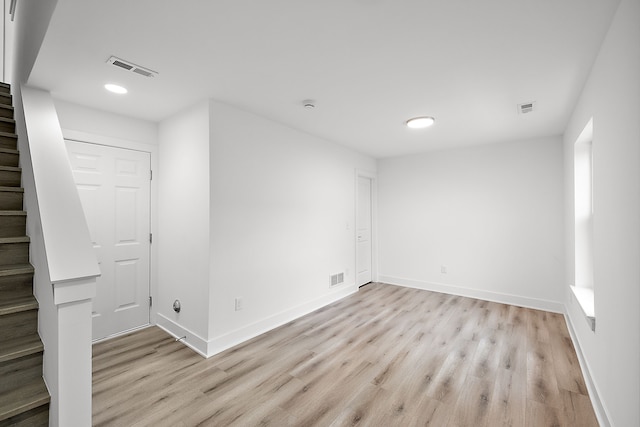 spare room with light hardwood / wood-style flooring