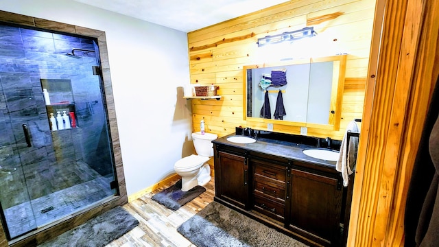 491 Bitter Creek Ln, Pierson, MI 49339 - full bath with double vanity, a shower stall, wood walls, wood finished floors, and toilet