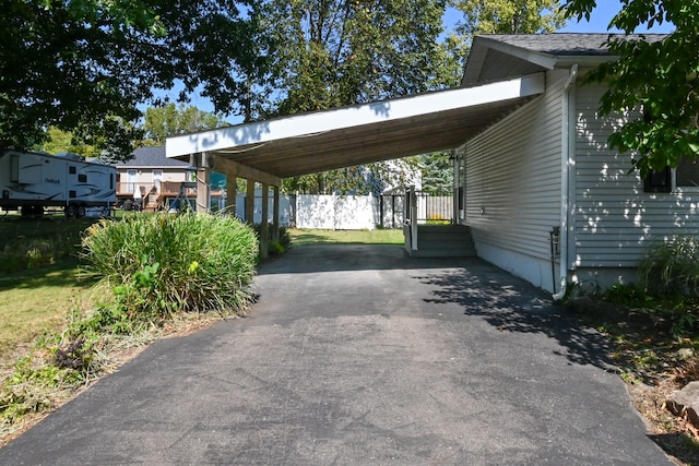 view of vehicle parking featuring a carport