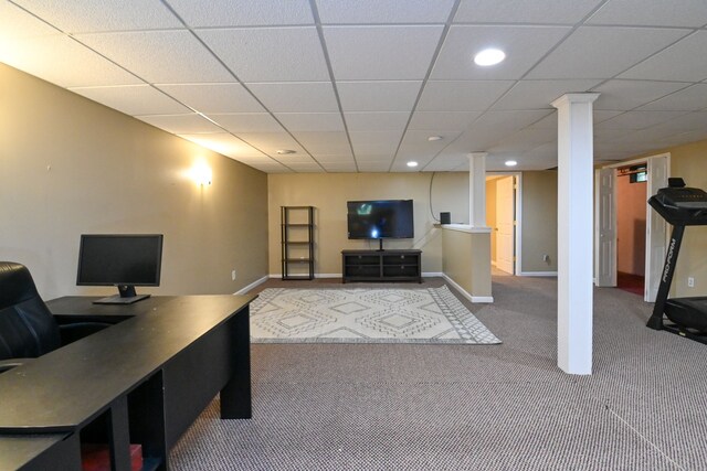 home office with carpet floors and a paneled ceiling