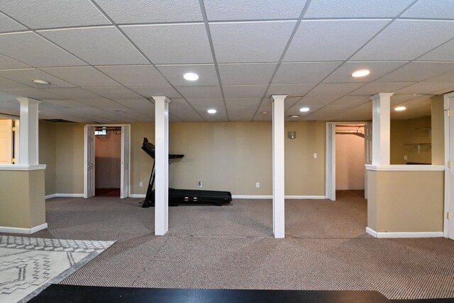 basement with carpet and a drop ceiling