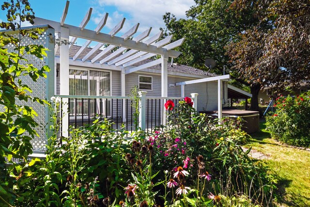 view of home's exterior featuring a pergola