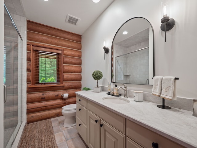 bathroom with vanity, toilet, an enclosed shower, and rustic walls