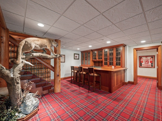 bar featuring a paneled ceiling