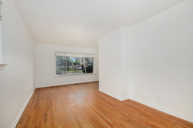 unfurnished room featuring light hardwood / wood-style floors