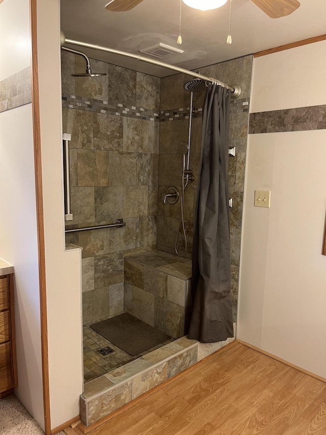 bathroom featuring hardwood / wood-style floors, vanity, ceiling fan, and a shower with shower curtain