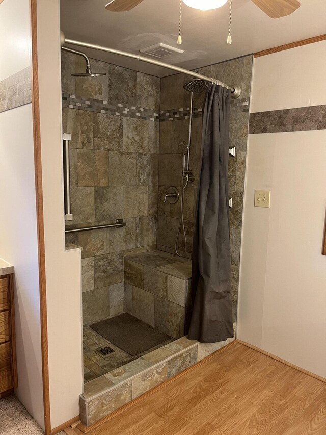 8181 15 Mile Rd, Evart, MI 49631 - full bath featuring tiled shower, ceiling fan, wood finished floors, and vanity