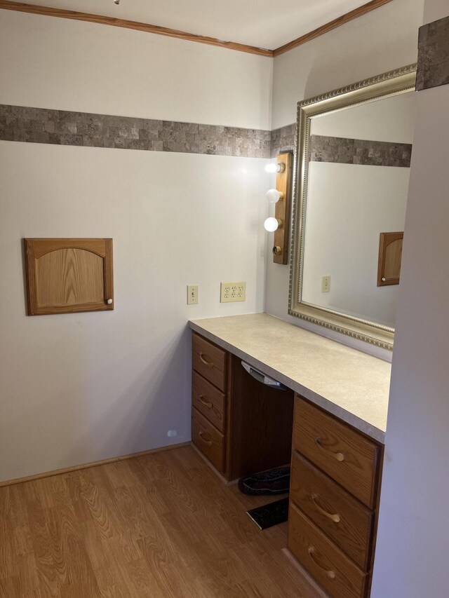 8181 15 Mile Rd, Evart, MI 49631 - bathroom featuring wood finished floors, crown molding, and vanity