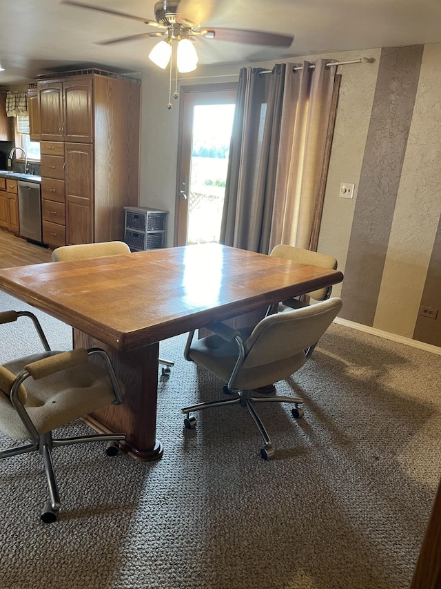 office space with ceiling fan and sink