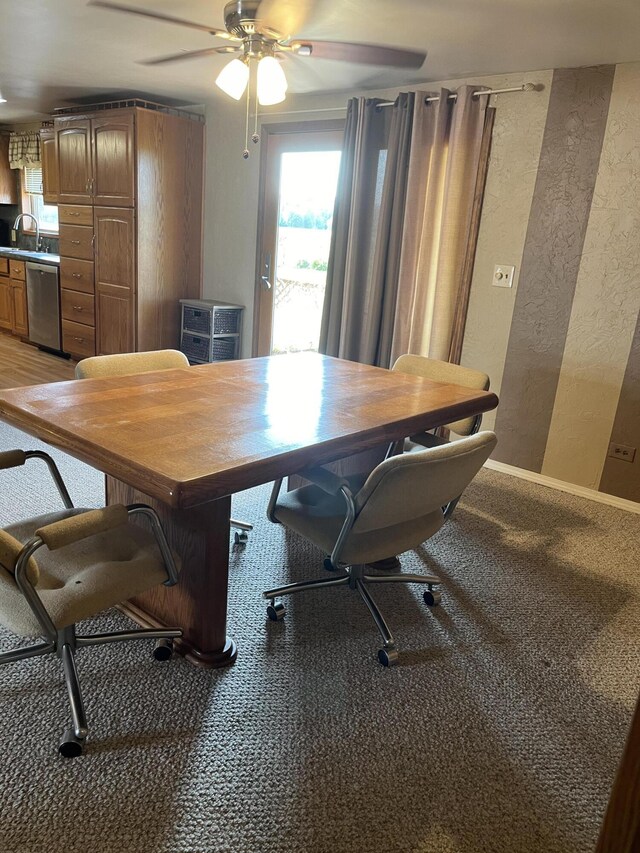 8181 15 Mile Rd, Evart, MI 49631 - dining area featuring a textured wall, plenty of natural light, a desk, and a ceiling fan