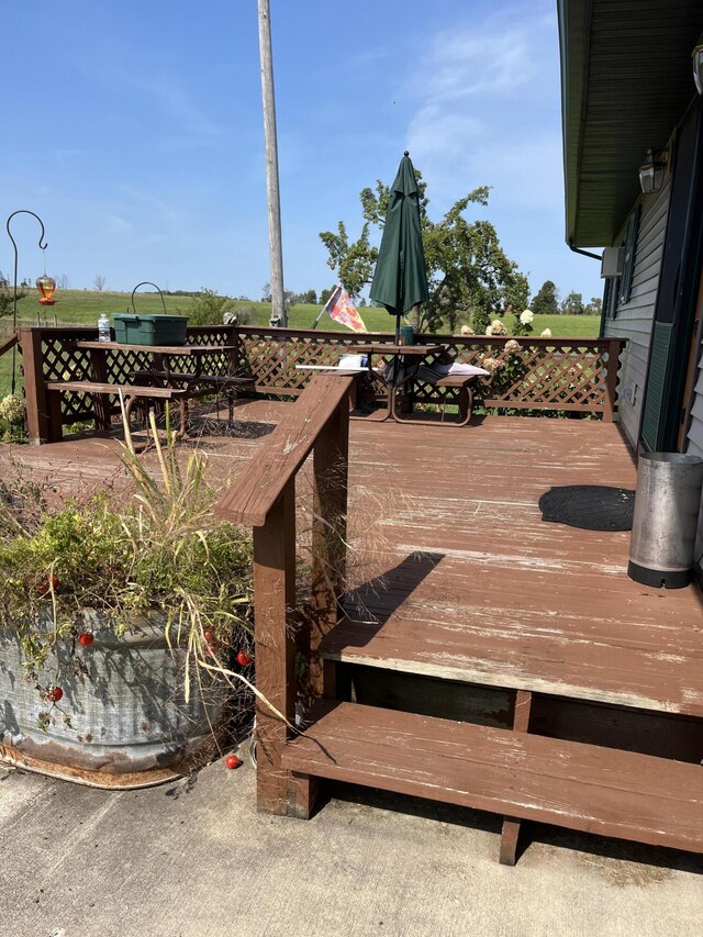 8181 15 Mile Rd, Evart, MI 49631 - wooden terrace with outdoor dining area
