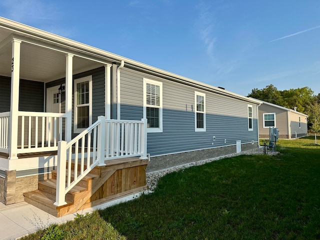 view of home's exterior featuring a yard