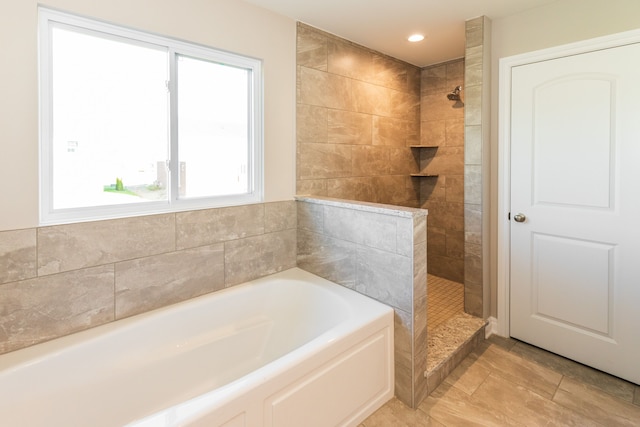 full bath featuring walk in shower, a garden tub, and recessed lighting