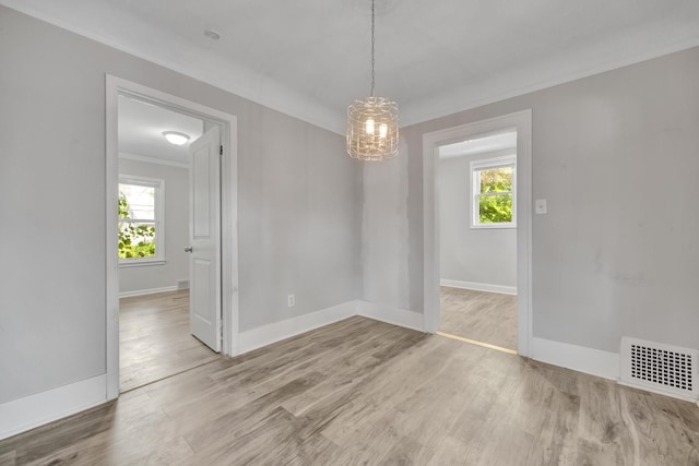 unfurnished dining area with plenty of natural light and light hardwood / wood-style flooring