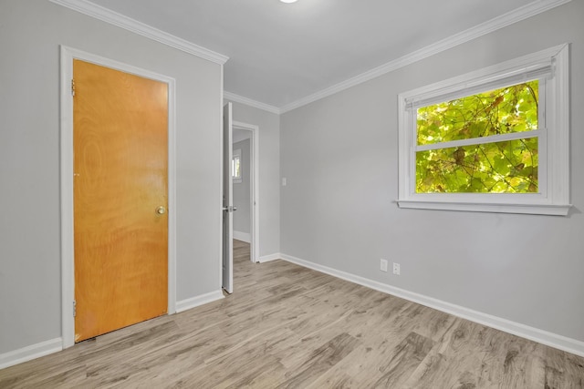 unfurnished bedroom featuring light wood-type flooring and ornamental molding