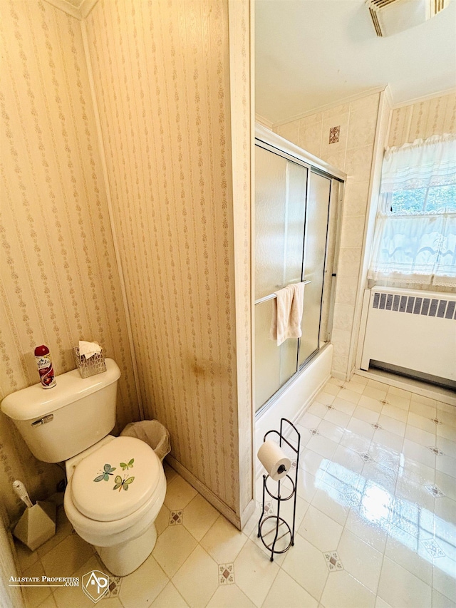 full bath featuring wallpapered walls, a shower stall, radiator heating unit, and toilet