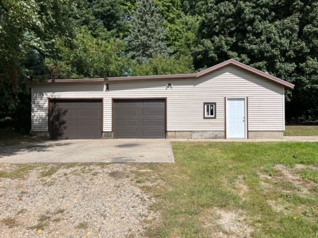 garage with a lawn