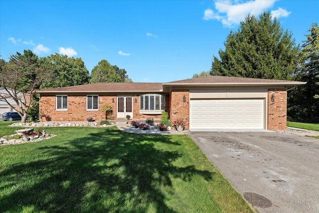 ranch-style house with a garage and a front lawn