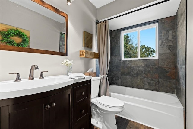 full bathroom with vanity, shower / bathtub combination with curtain, wood-type flooring, and toilet