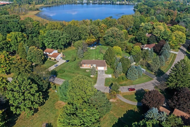 birds eye view of property with a water view